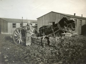 Water-cart and man in mud