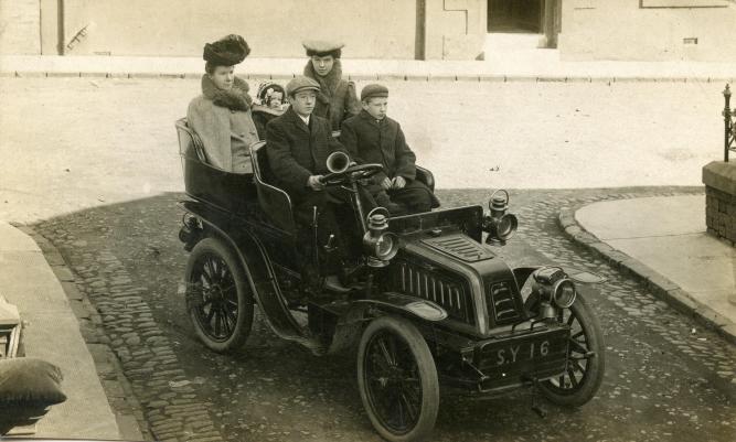 The Fleming family in Kilmarnock, 1907 (John driving, Wallace, mother Marion, May & Mary)